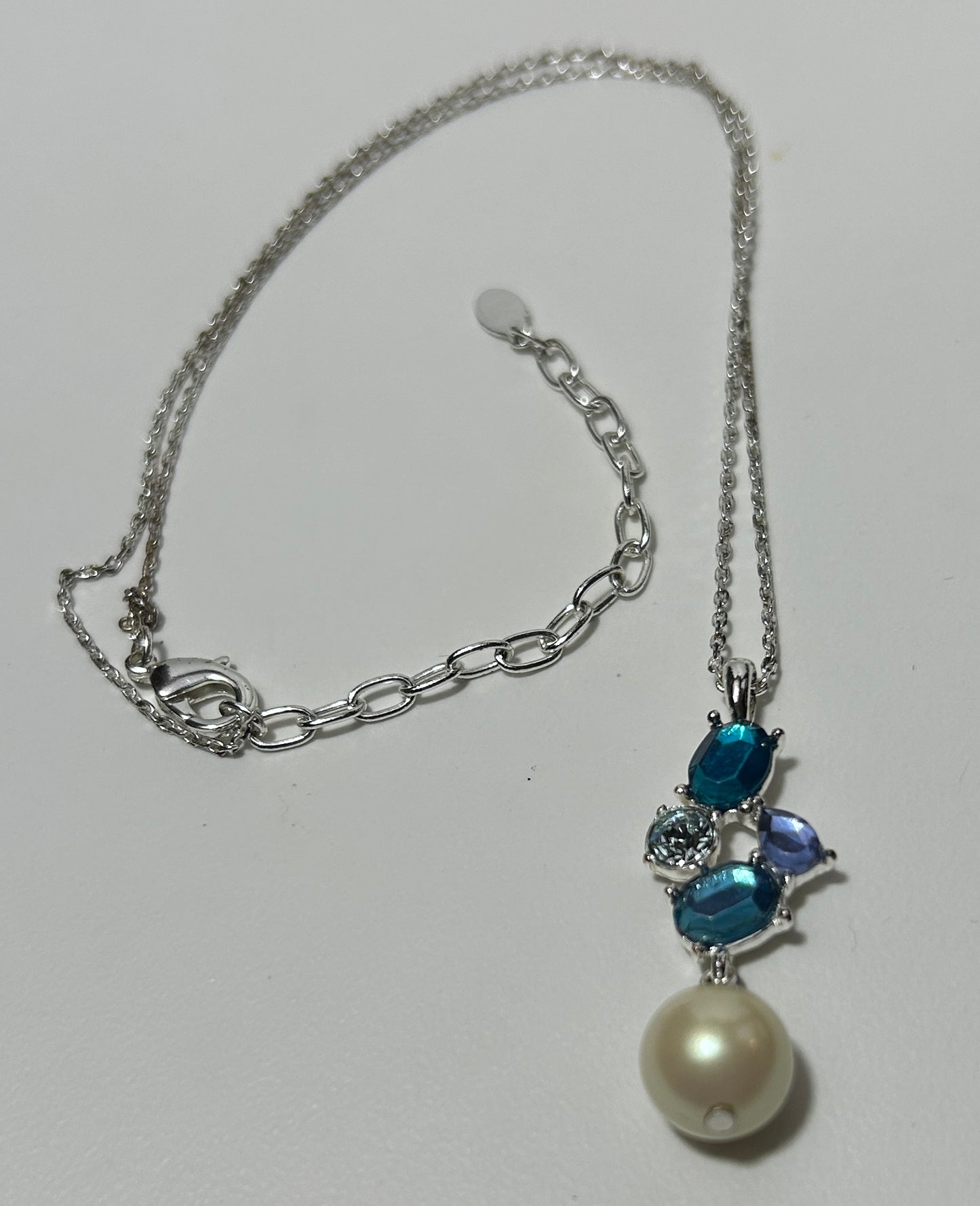 Silver-Tone Necklace with Blue Gemstone Cluster & Faux Pearl Drop Pendant – Elegant Statement Jewelry