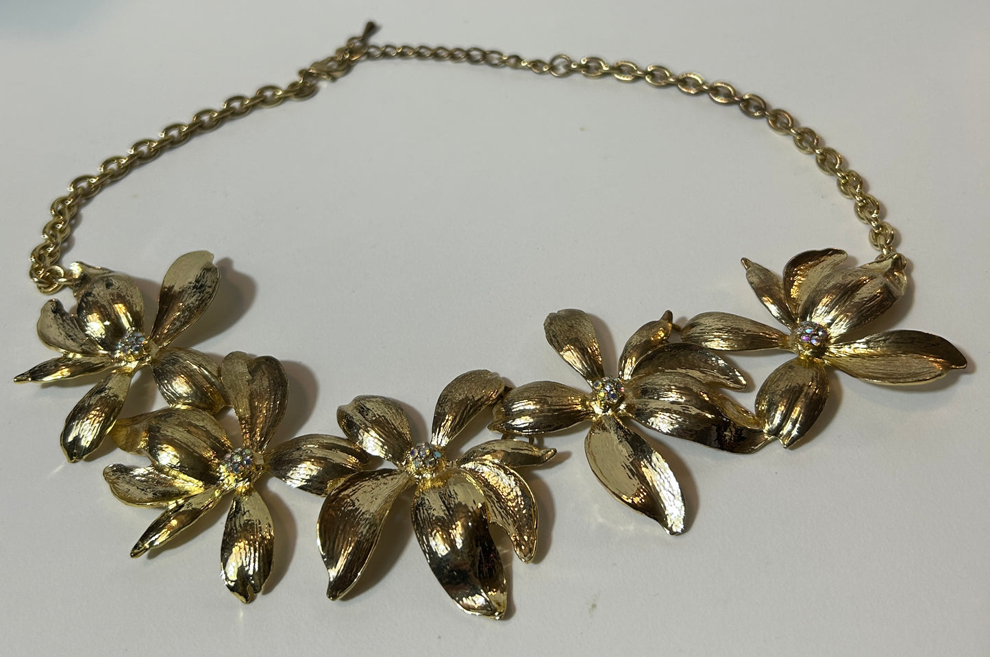 Vintage Gold-Tone Floral Statement Necklace with Textured Petals and Rhinestone Centers