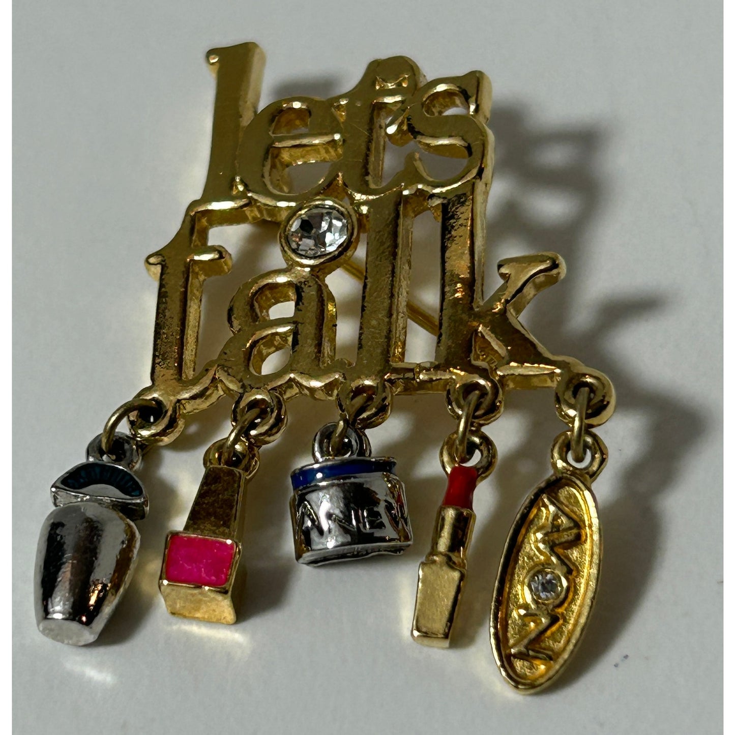 Vintage Avon "Let's Talk" Gold Tone Brooch with Makeup Charms, Rhinestone Accent