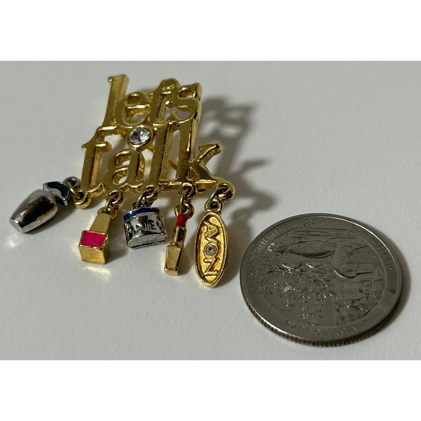 Vintage Avon "Let's Talk" Gold Tone Brooch with Makeup Charms, Rhinestone Accent