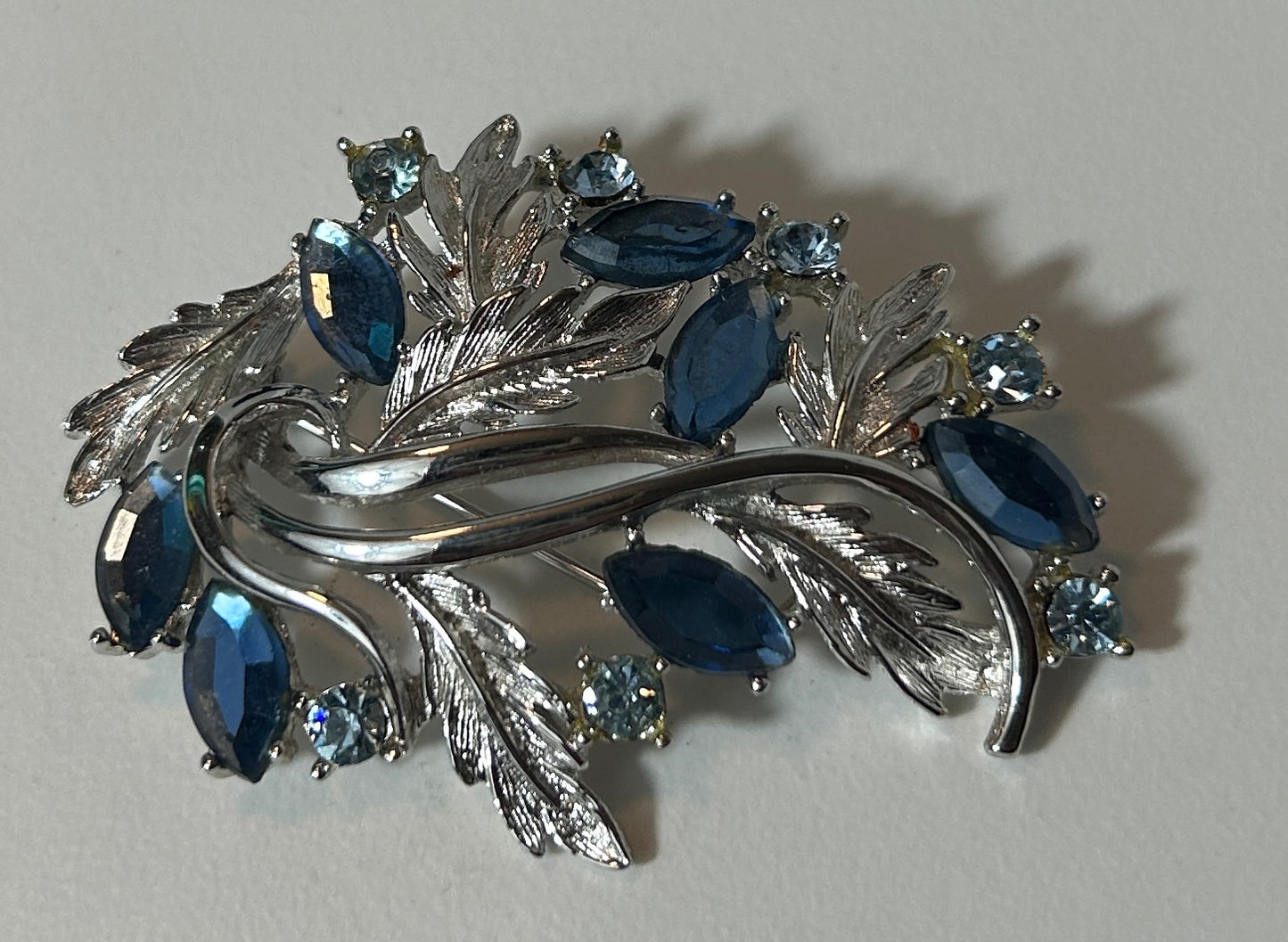 Vintage Silver Tone Leaf and Sapphire Blue Rhinestone Brooch Pin